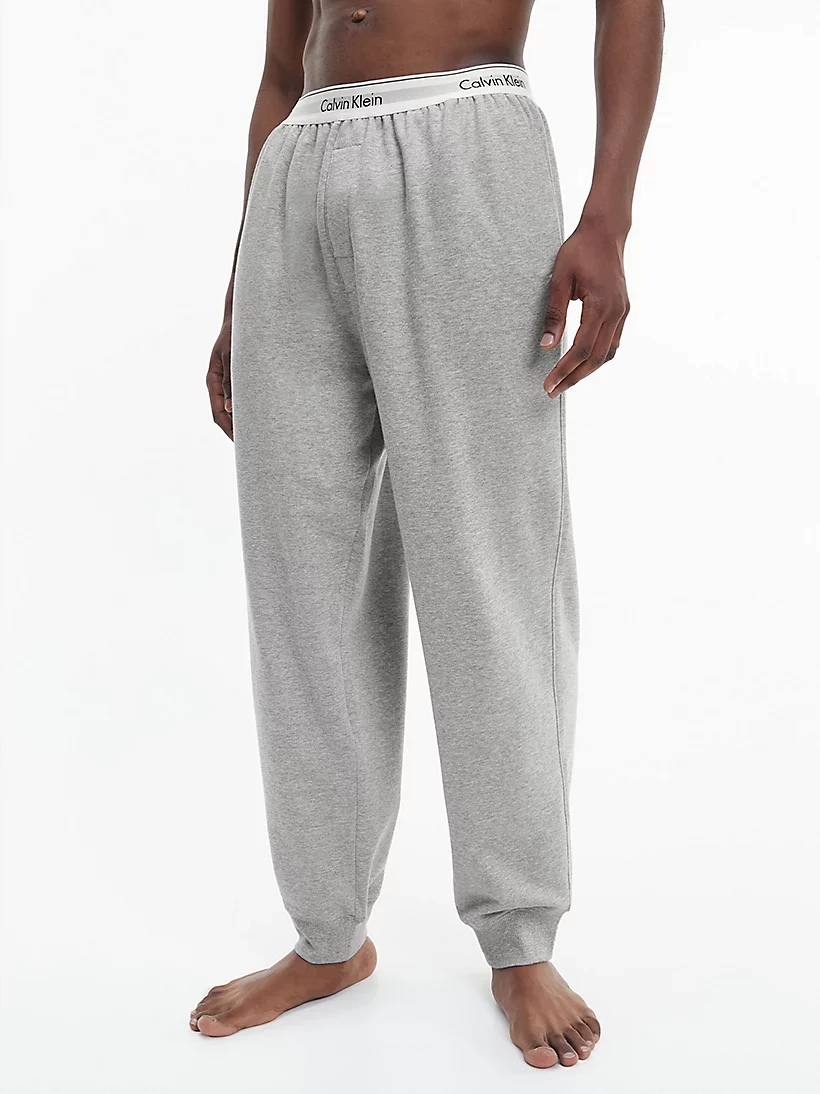 CALVIN KLEIN teplákové nohavice NM 2302E P74 farba svetlo sivá