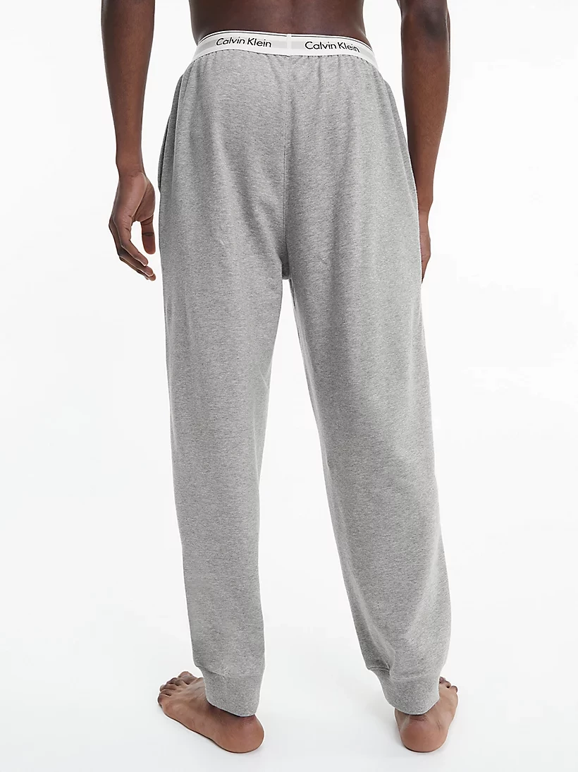 CALVIN KLEIN teplákové nohavice NM 2302E P74 farba svetlo sivá