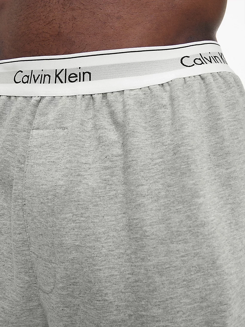 CALVIN KLEIN teplákové nohavice NM 2302E P74 farba svetlo sivá